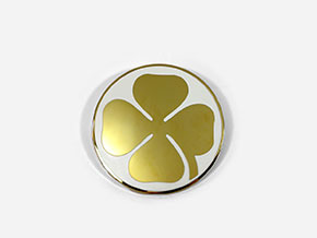 Golden cloverleaf badge on c - pillar right / left